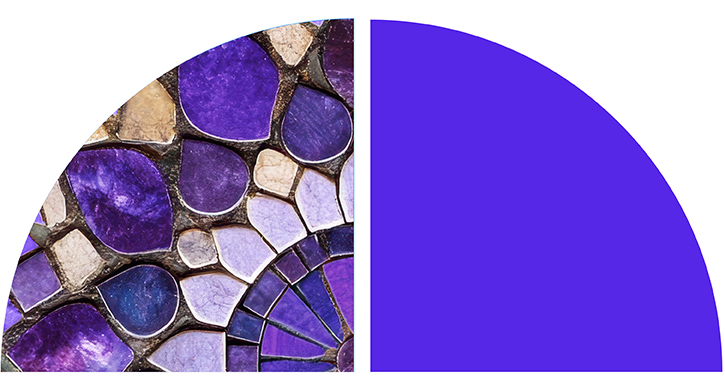 A close-up of a detailed purple mosaic design, with intricate tiles forming a symmetrical pattern.